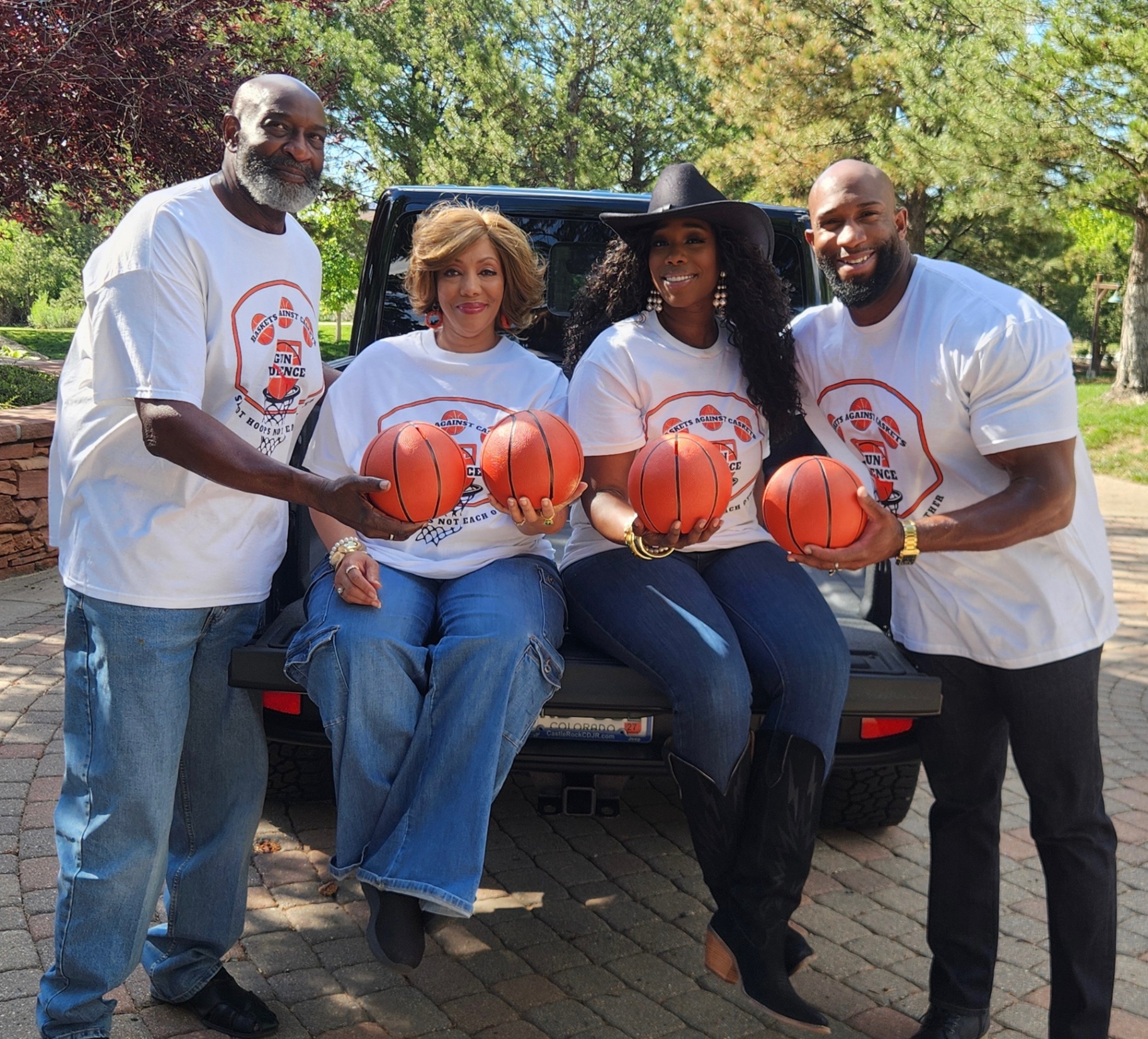 Baskets Against Caskets leadership team standing together with basketballs